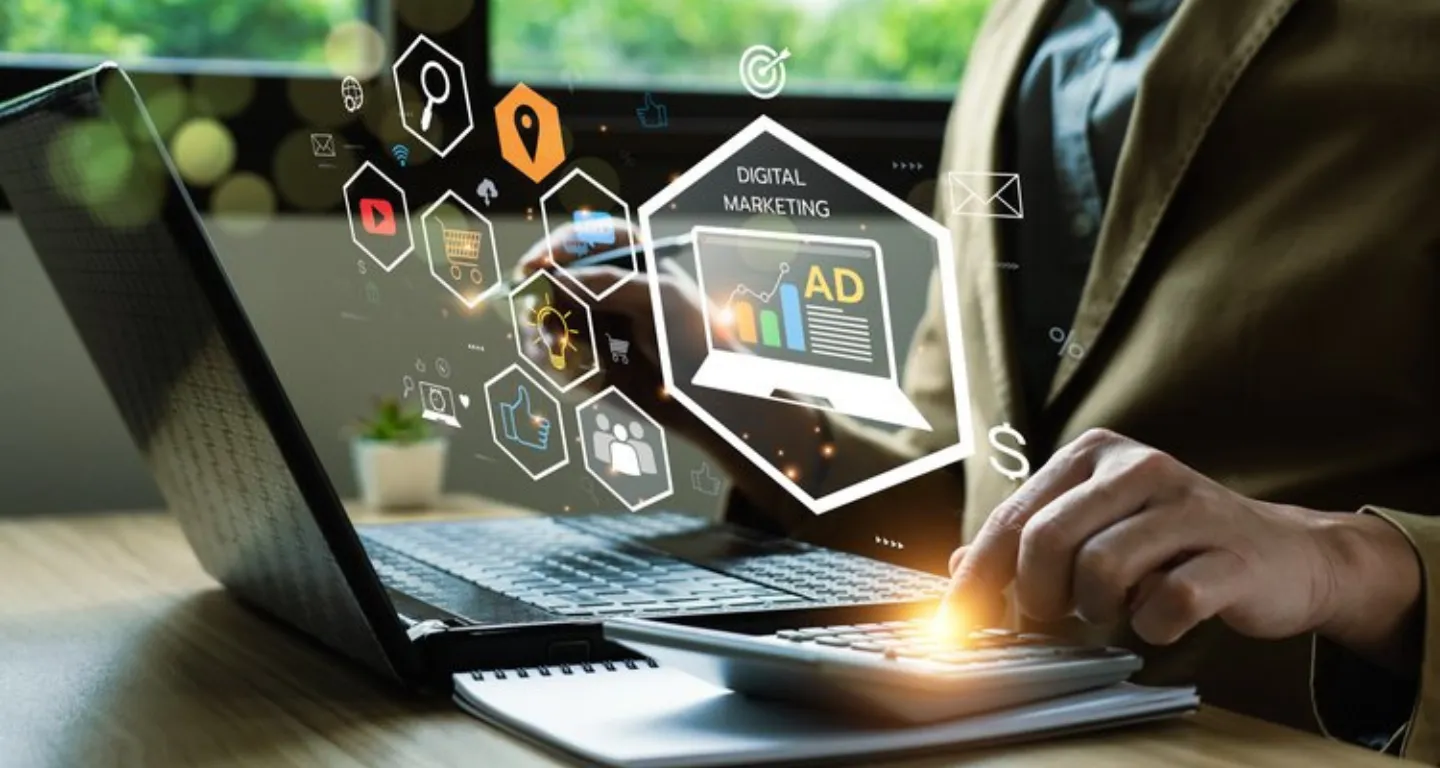 Marketer working on a laptop with digital marketing icons overlayed, symbolizing how a storyboard maker app helps plan ad sequences, branding messages, and product visuals for campaigns.